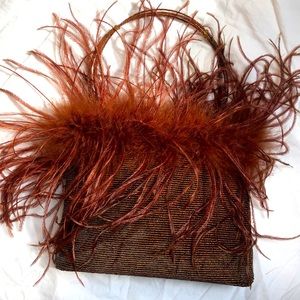 NWOT Beaded handbag with feather trim. Never used!!